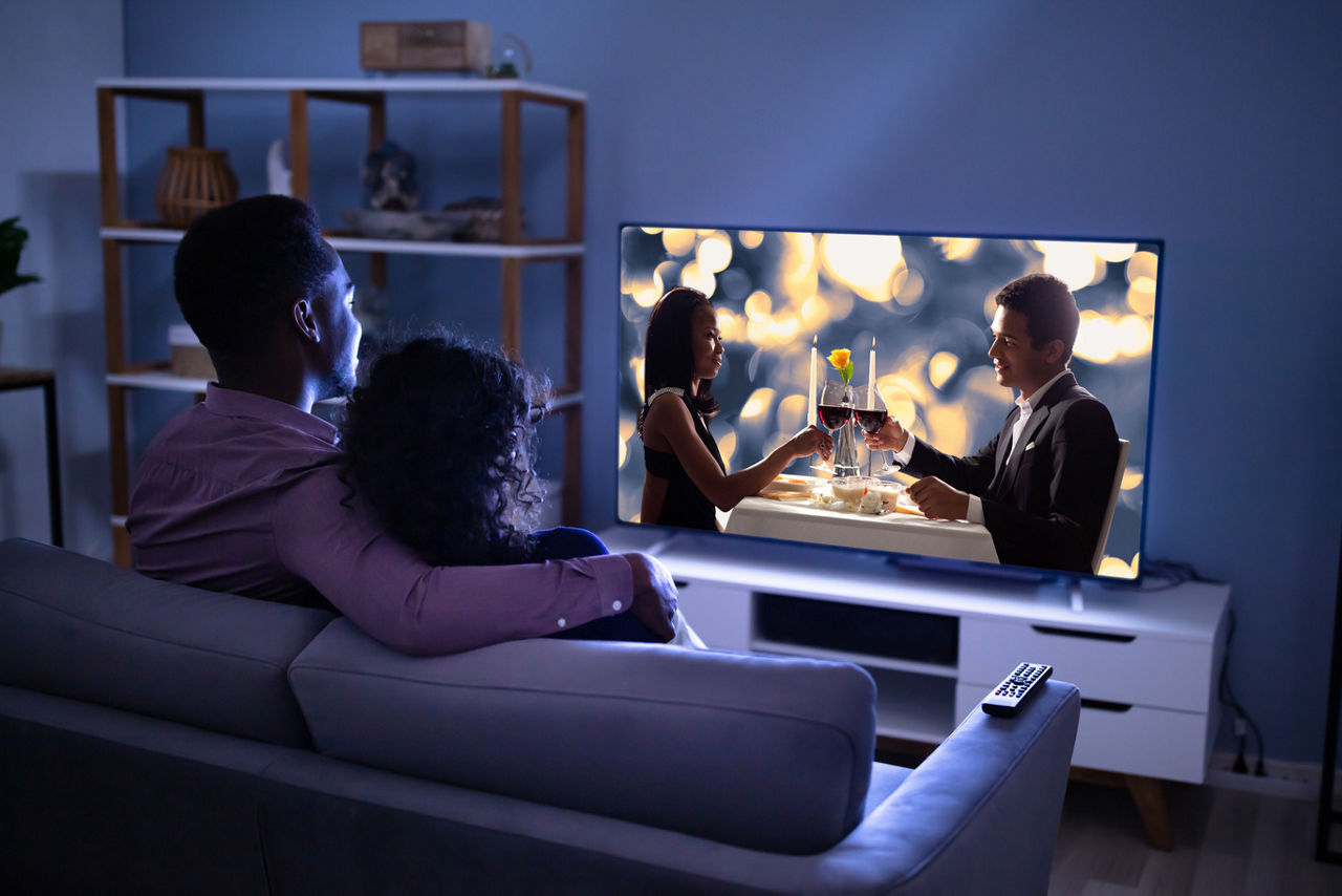 A couple watching a romantic movie together | Blog | Greystar 
